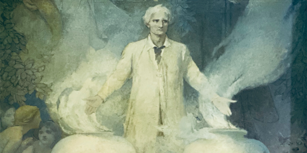 Scientist/engineer in front of two containers of emanating vapors
